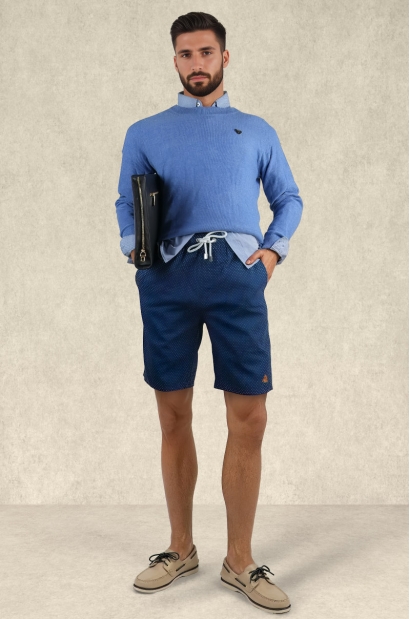 Mens navy swim shorts with white dots worn