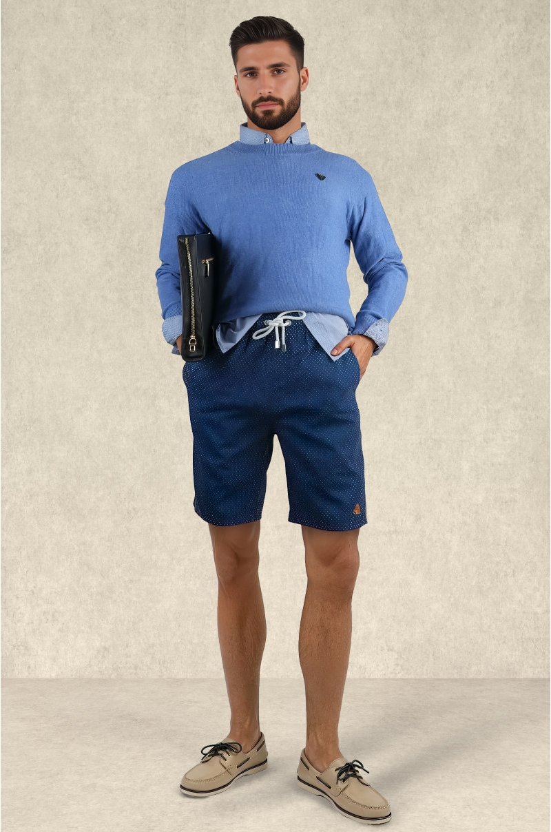 Mens navy swim shorts with white dots worn